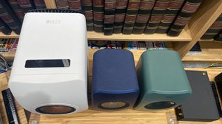 Top view of the white KEF LS50 Wireless II, blue LSX II and green LSX II LT speakers