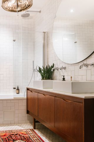 white bathroom with wooden vanity