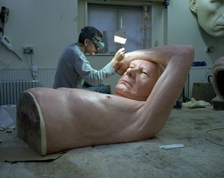 Artist creating a sculpture.