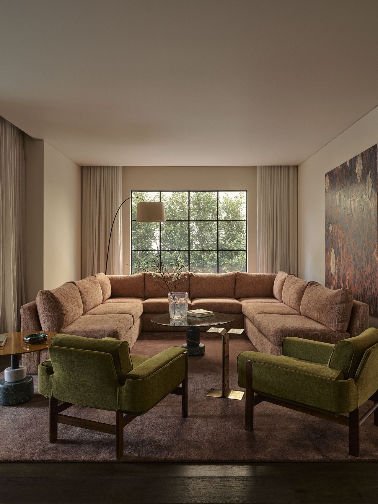 Living room in Smac Studio's renovated Art Deco home in Woollahra, Sydney, featuring a Pierre Augustin Rose sectional sofa.