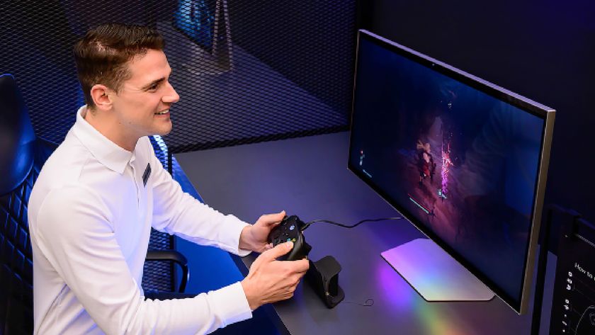 A promotional image showing a man in a white shirt happily playing a game on a Samsung Odyssey 3D monitor