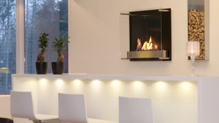 bioethanol wall mounted fireplace in contemporary white kitchen