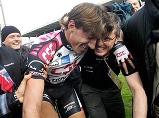 Fabian Cancellara (CSC) is congratulated by team director Scott Sunderland in the velodrome