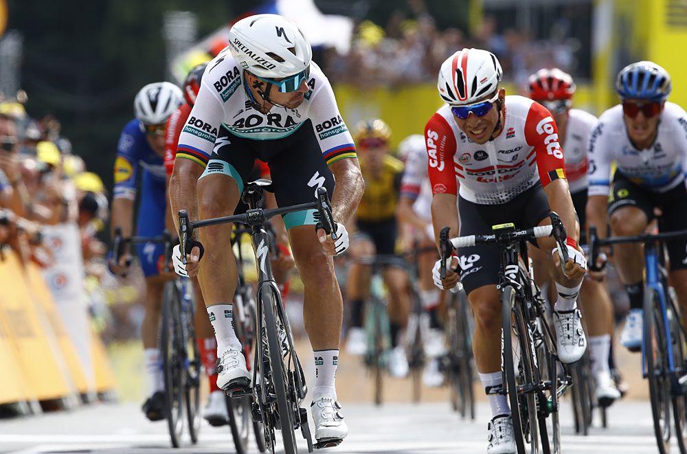 Mike Teunissen (Jumbo-Visma) beats Peter Sagan (Bora-Hansgrohe) and Caleb Ewan (Lotto Soudal) to win the opening stage at the Tour de France in Brussels