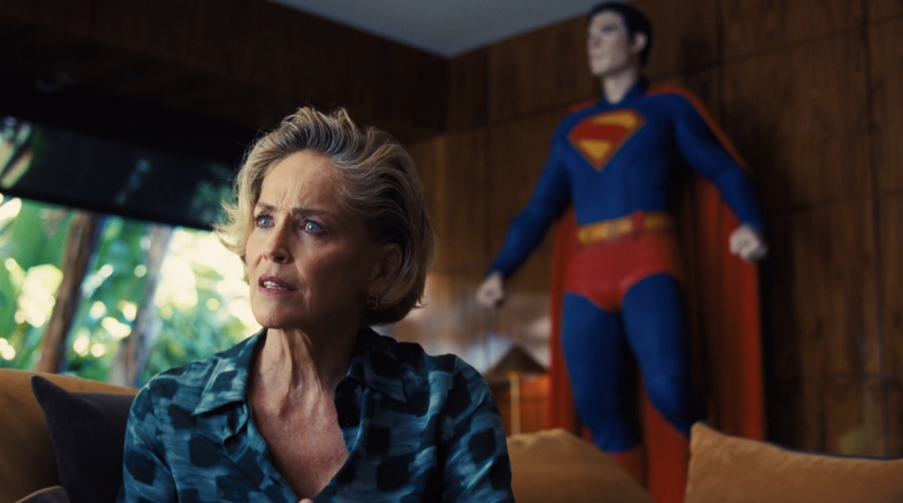 Patty Lance (Sharon Stone) sits in her office, where there's a Superman standee, on Euphoria.