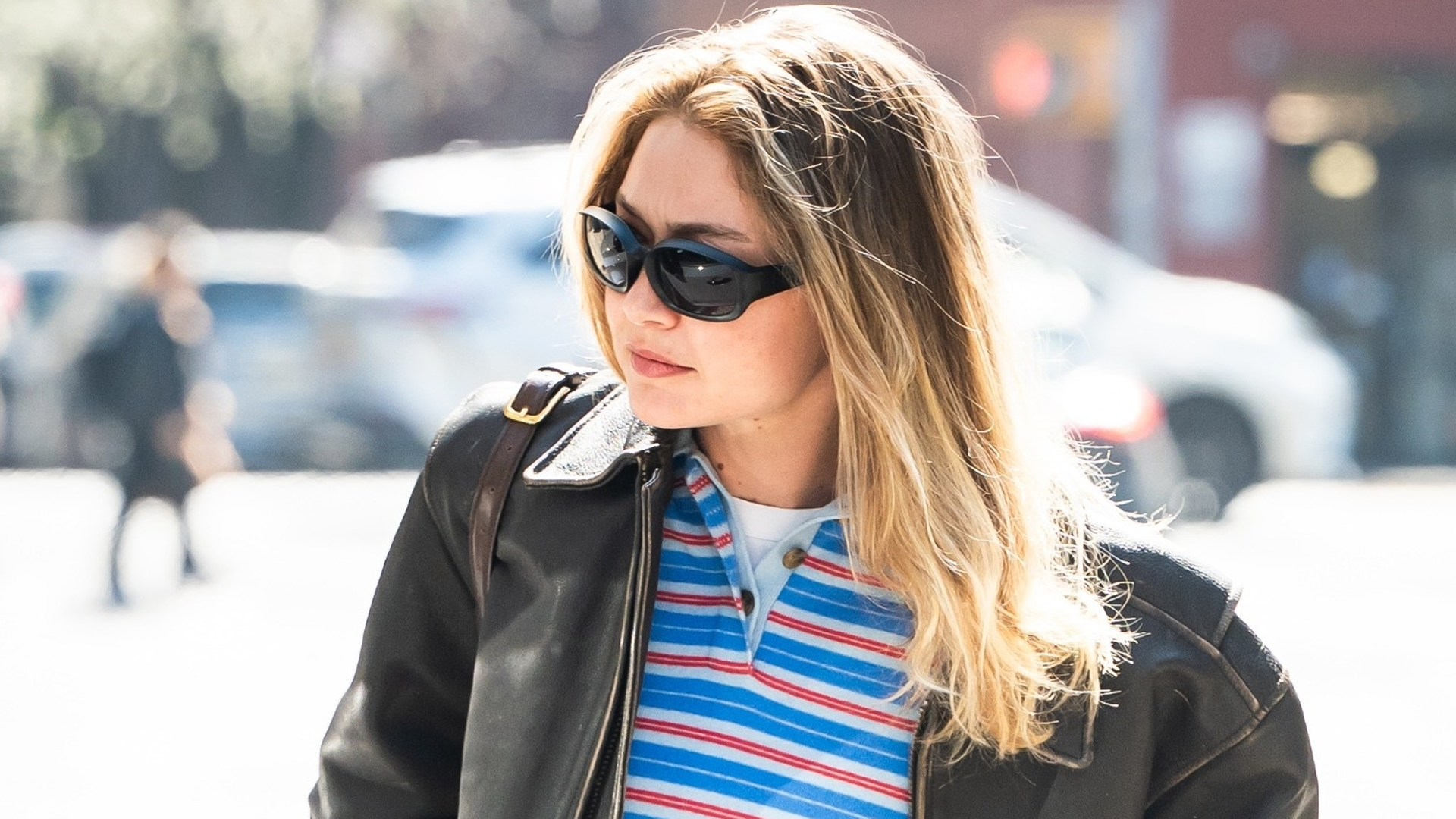 Gigi Hadid wore the rugby shirt trend with a leather bomber jacket and straight-leg jeans