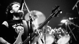 Lemmy of the group Motorhead, plays bass guitar as he performs onstage at the Palladium , New York, New York, May 14, 1982.