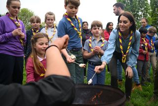 Kate Middleton, Prince George, Princess Charlotte, and Prince Louis at the Big Help Out roasting marshmallows