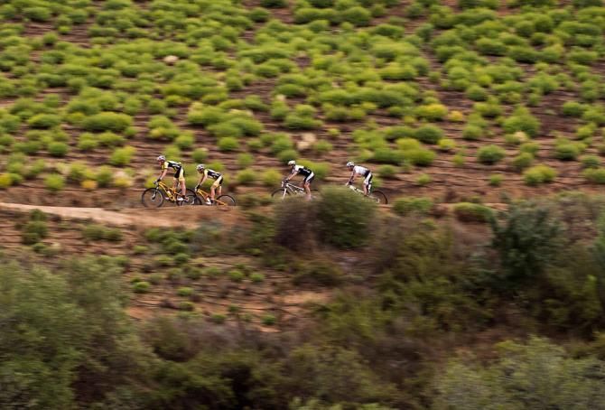 Jaroslav Kulhavy and Christoph Sauser of Burry Stander-Songo lead Tim Boehme of Bulls 2 and Max Knox of Burry Stander-Songo 2