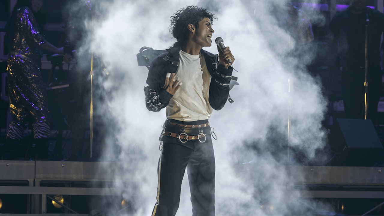 Jaafar Jackson as Michael Jackson on stage with smoke behind him 