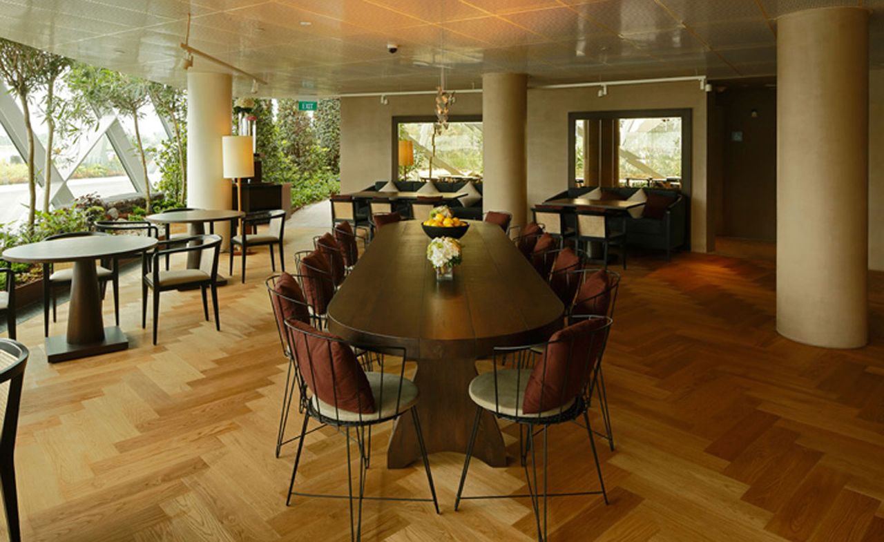 Long dining table in center of restaurant