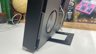 Samsung Music Frame wireless speaker showing edge and back of frame on white shelf