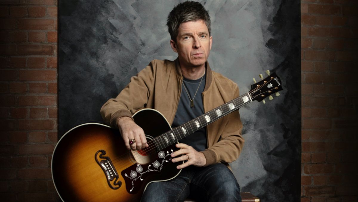 Noel Gallagher with the Gibson signature J-150 acoustic guitar