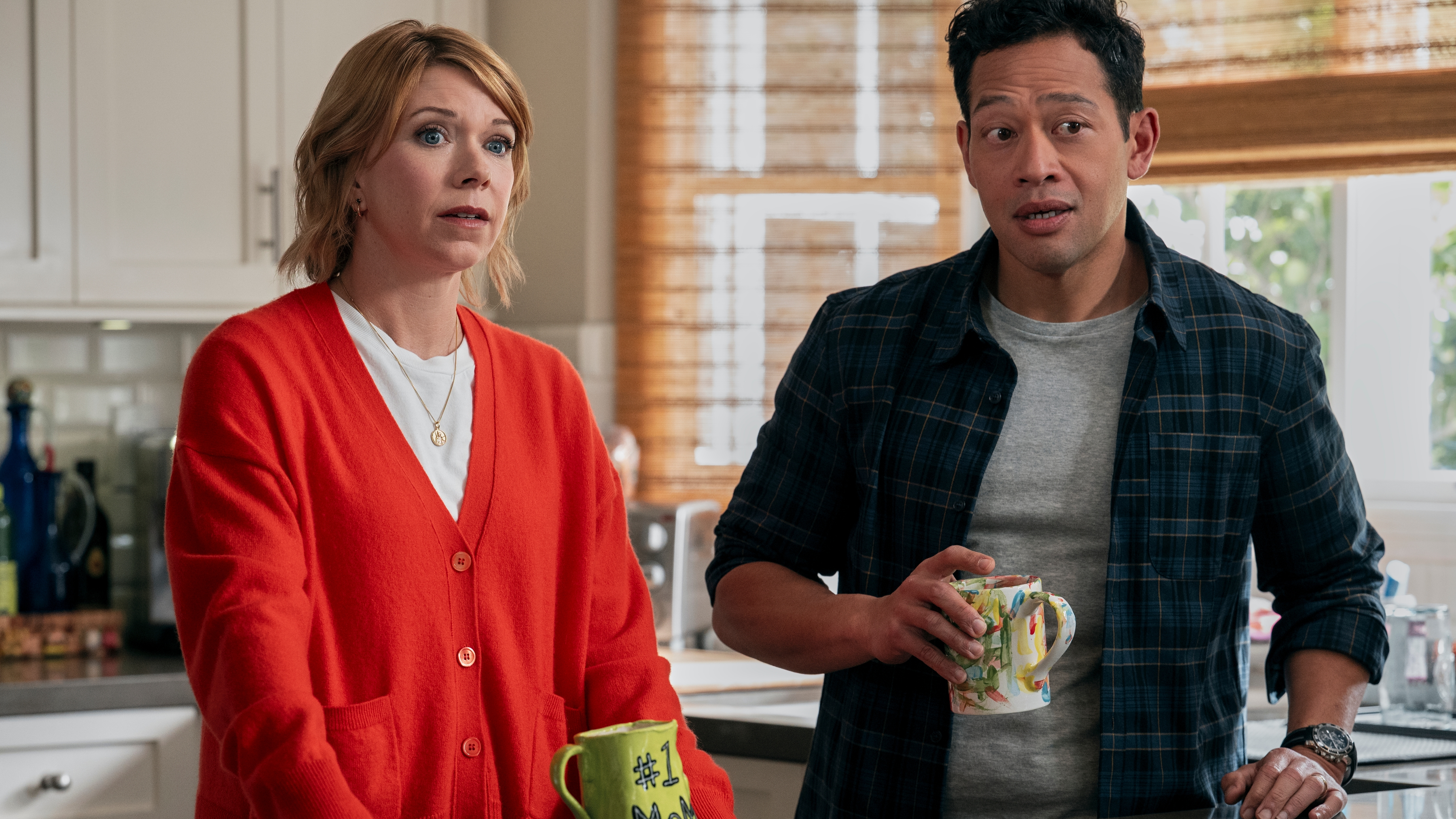 L-R: Emily (Mary Elizabeth Ellis) and Joel (Eugene Cordero) in the kitchen in "A Man on the Inside" season 2