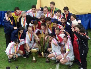 Canada players celebrate with the CONCACAF Gold Cup trophy after beating Colombia in the final in 2000.
