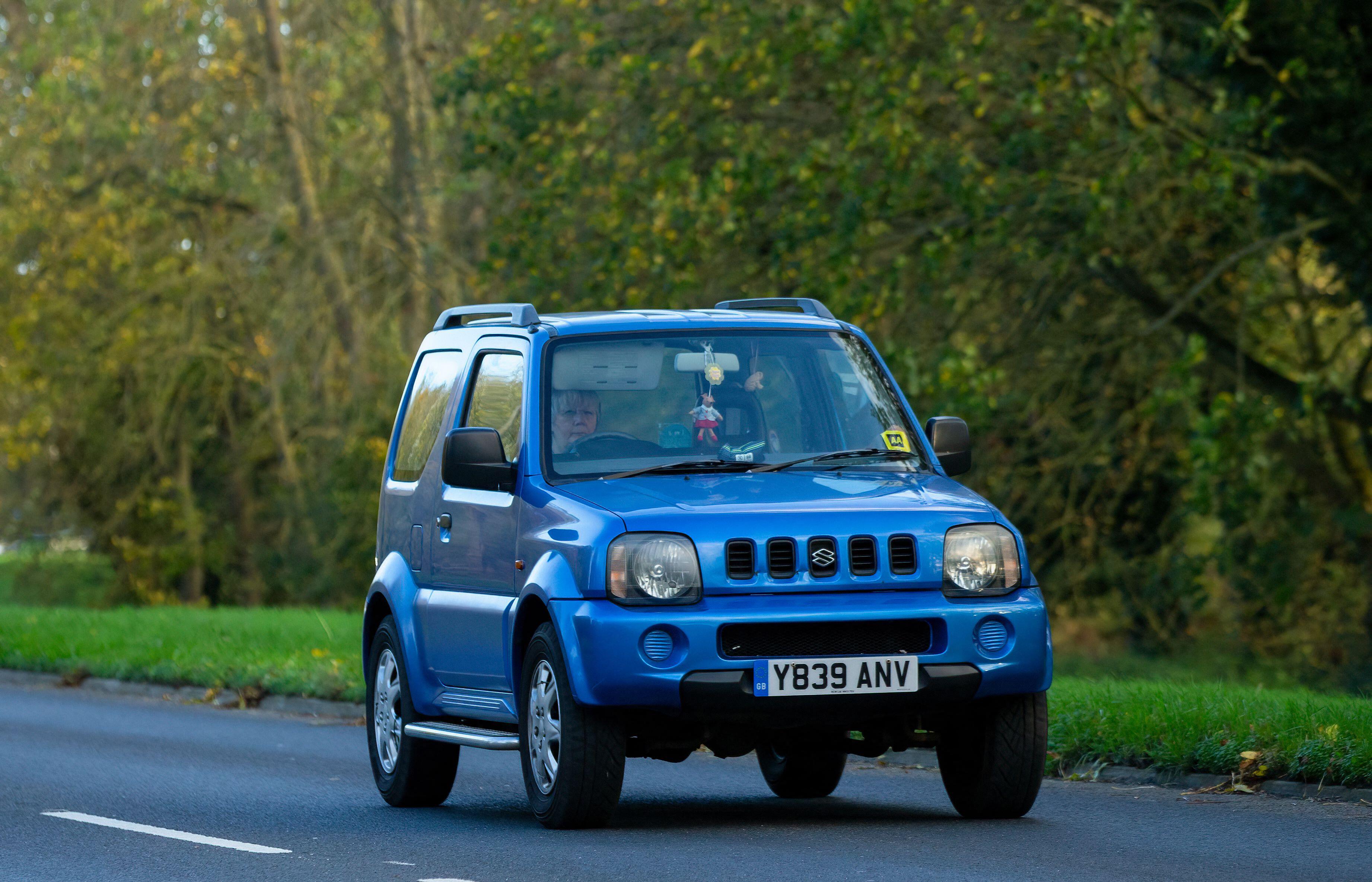 2001 blue Suzuki Jimny