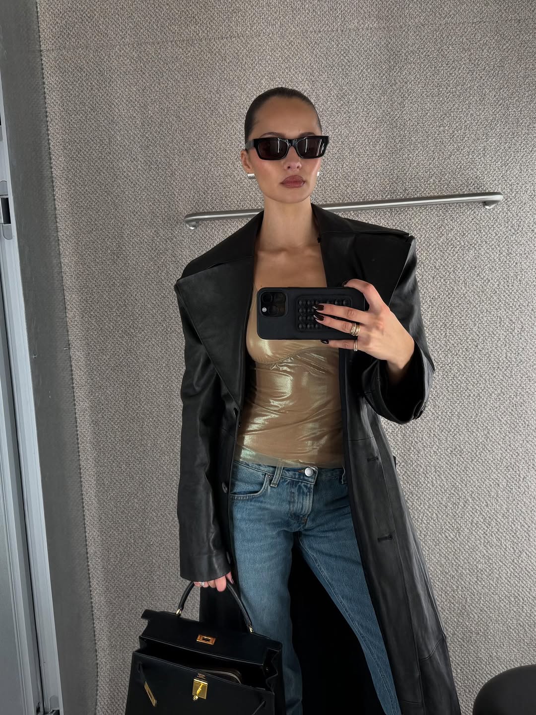 woman wearing holiday denim outfit 2025