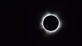 the moon blocks out the sun during an eclipse. a ring of light is still visible