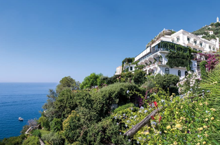 view of a hotel perched on a cliff