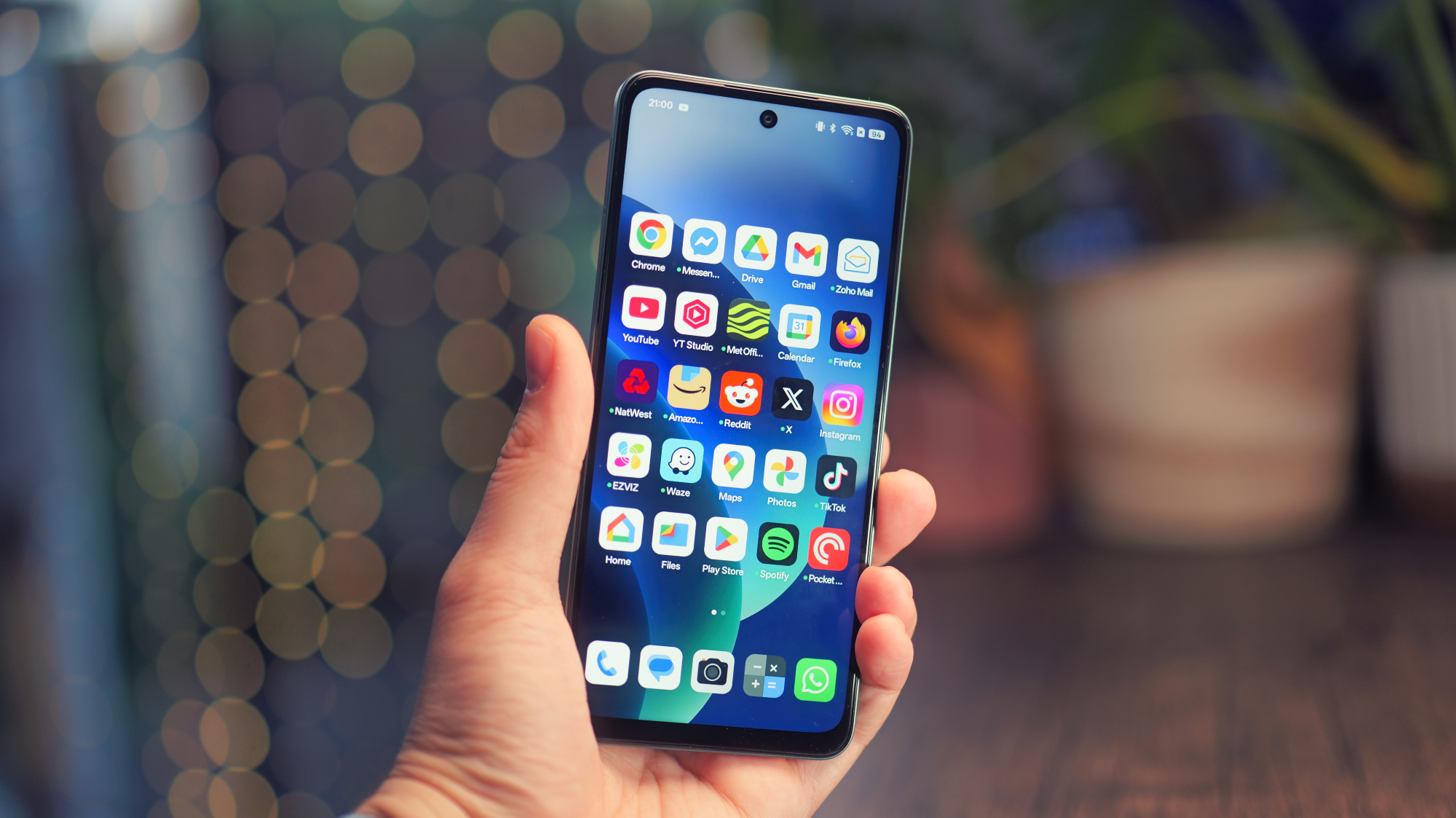 Oppo A5 5G phone held in a hand