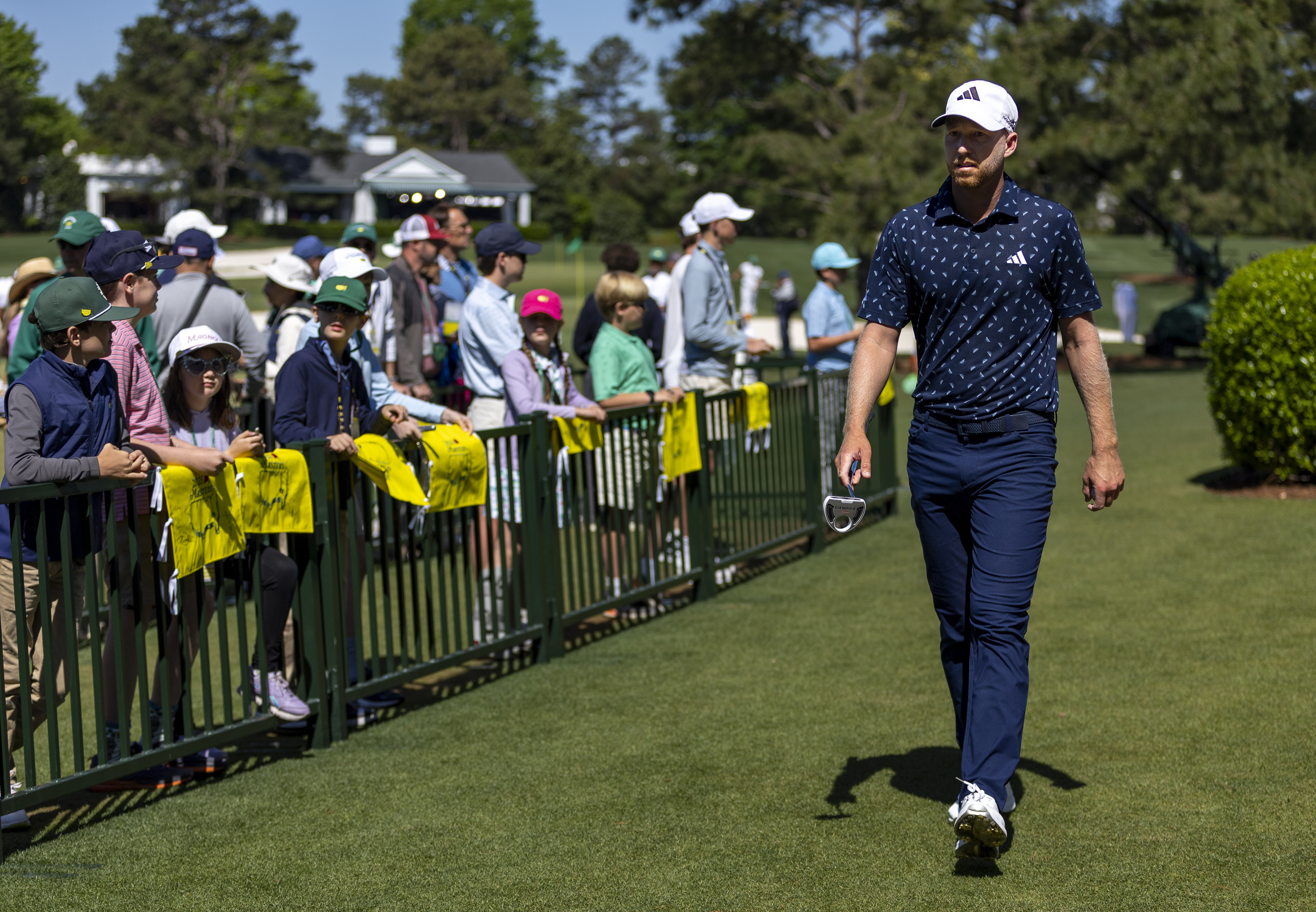Daniel Berger walks along at The Masters in 2025