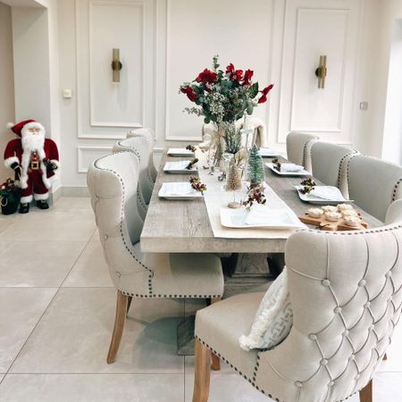 neutral dining room with wooden table and wall panelling and dining chairs