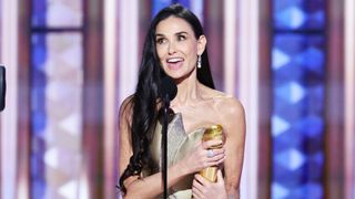 Demi Moore accepts a Golden Globe Award for her performance in 'The Substance,' at the 2025 Golden Globes.