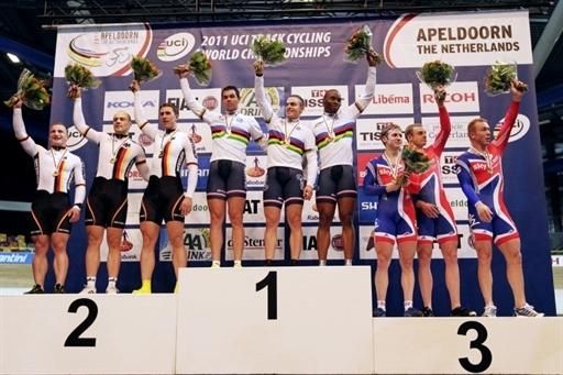 Gold medallist Australian team celebrates flanked by silver medallist Italian team and bronze medallist Great Britain during the team pursuit medal ceremony
