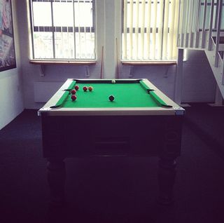 Designer Simon Jobling takes his mind off the task in hand with a game of pool