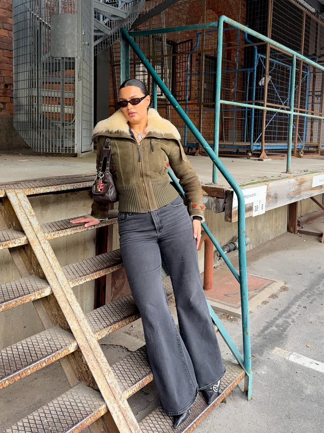 woman wearing winter denim outfit idea 2025