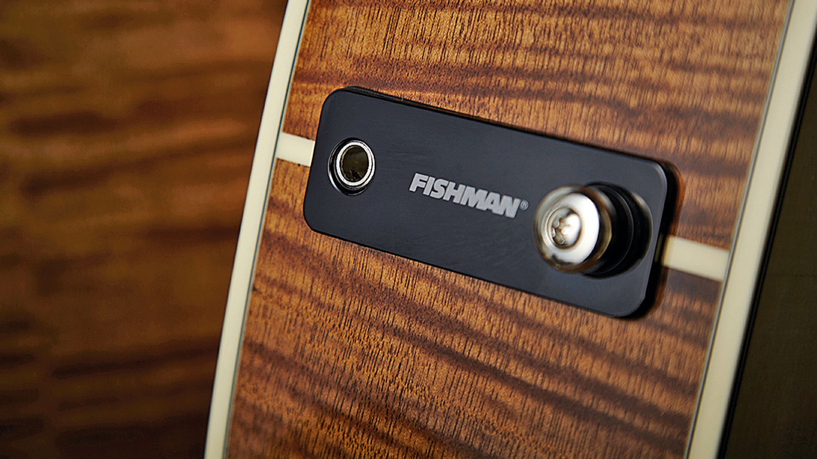 A stylish and convenient solution to housing a battery, a jack socket and a strap button