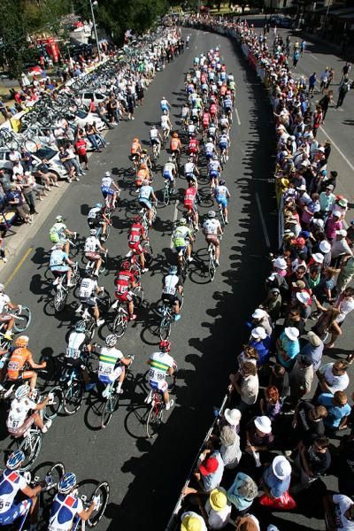 The peloton rounds the pit straight on the 1.7 kilometre circuit.