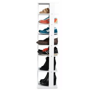 A seven tier shoe storage shelf with shoes in it