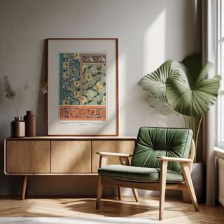 Nasturtium print on wall in living space with green armchair