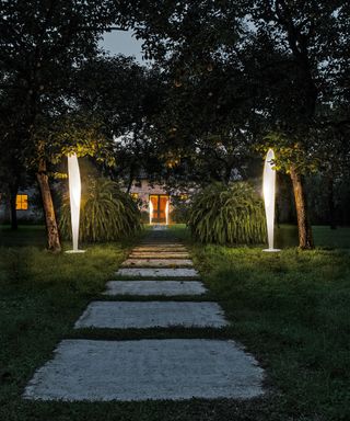 freestanding garden lamps in night time garden