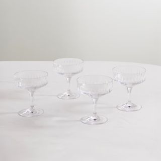 set of four glass champagne coupes