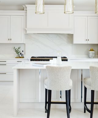 White kitchen with marble backsplash