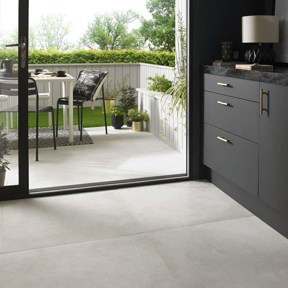 kitchen room with tiled flooring and grey sliding glass door
