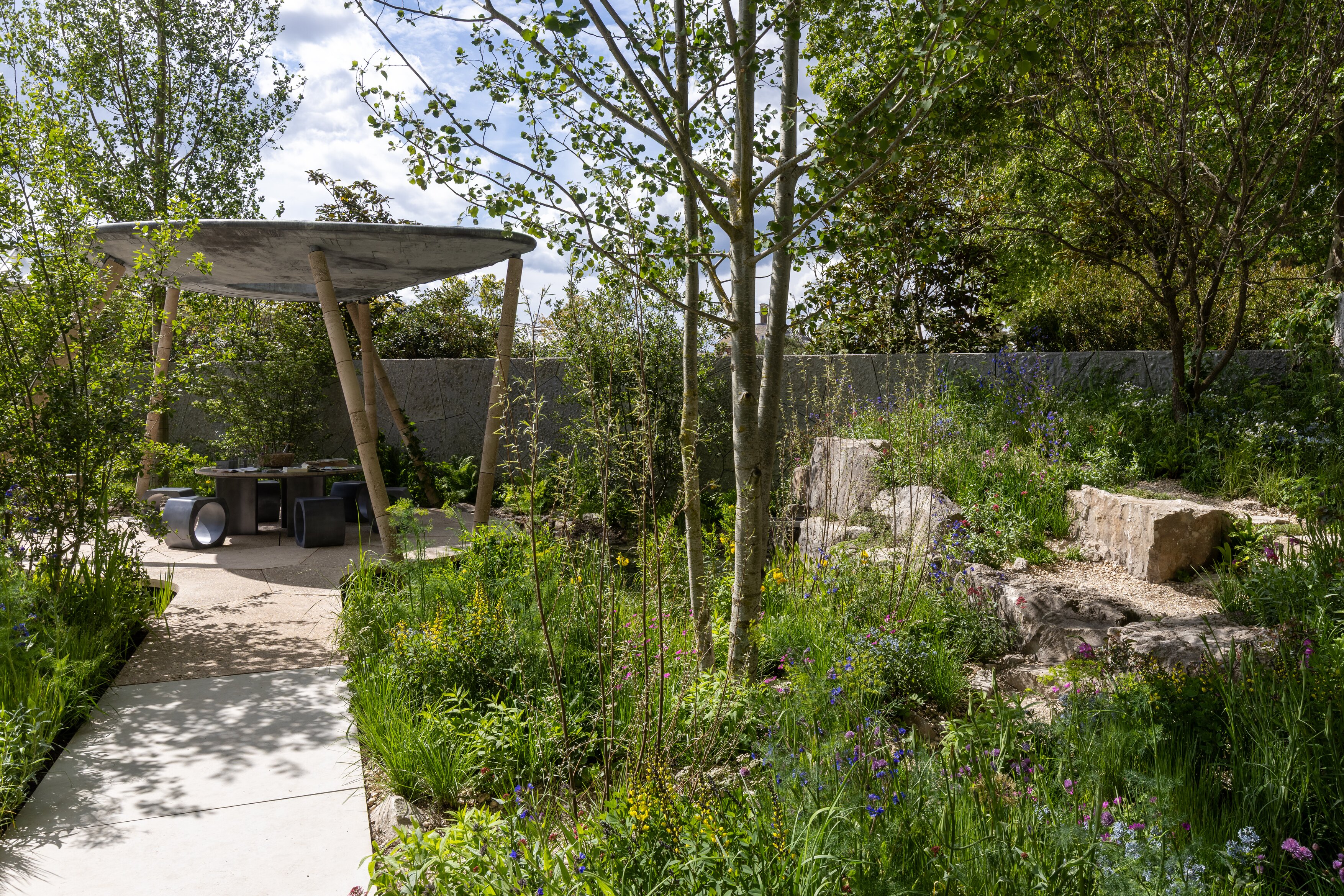 The Eden Project: Bring Me Sunshine Garden. Designed by Harry Holding and Alex Michaelis. Show Garden. RHS Chelsea Flower Show 2026. Site no. 325