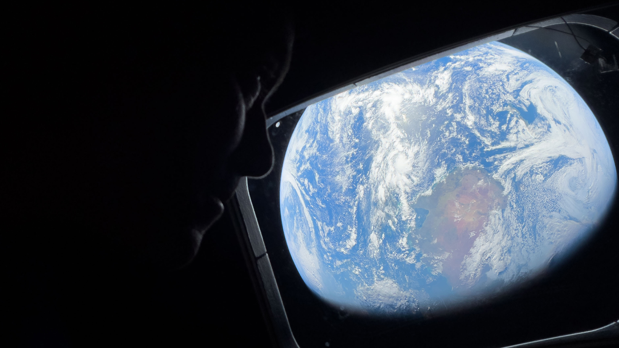 Christina H Koch's selfie on the Artemis II with the Earth in the background