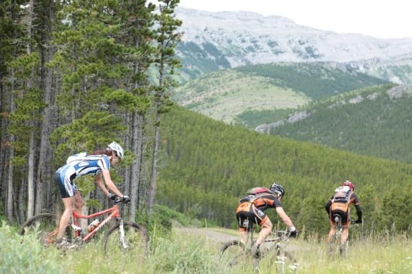 The high Rockies loom in the background as racers concentrate on the task at hand.