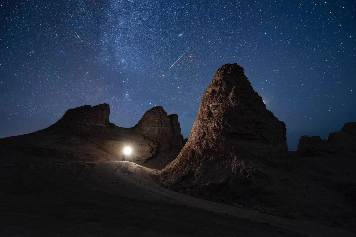 The Perseid meteor shower illuminate the night sky over the Eboliang Yardang landform on August 12, 2022 in Haixi Mongolian and Tibetan Autonomous Prefecture, Qinghai Province of China.