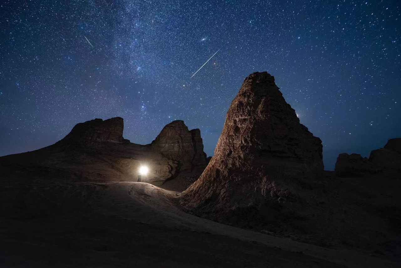 The Perseid meteor shower illuminate the night sky over the Eboliang Yardang landform on August 12, 2022 in Haixi Mongolian and Tibetan Autonomous Prefecture, Qinghai Province of China.