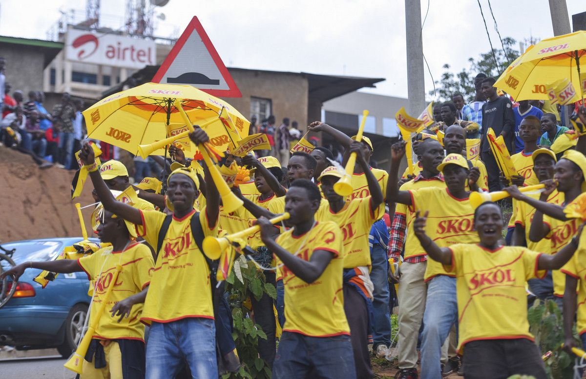 The fans decked in Skol shirts with yellow vuvuzelas