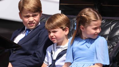 Prince George of Cambridge, Prince Louis of Cambridge and Princess Charlotte of Cambridge travel in a horse-drawn carriage during Trooping The Colour on June 2, 2022 in London, England. Trooping The Colour, also known as The Queen's Birthday Parade, is a military ceremony performed by regiments of the British Army that has taken place since the mid-17th century. It marks the official birthday of the British Sovereign. This year, from June 2 to June 5, 2022, there is the added celebration of the Platinum Jubilee of Elizabeth II in the UK and Commonwealth to mark the 70th anniversary of her accession to the throne on 6 February 1952.