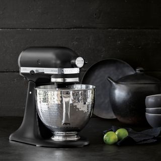black stand mixer on worktop with steel mixing bowl