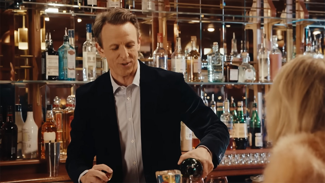 Seth Meyers pours Sabrina Carpenter a gross drink behind the bar in 2026 Day Drinking video. 