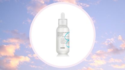 the COSRX Hydrium Triple Hyaluronic Moisture Ampoule in a white circle on a purple and pink cloud/sky background