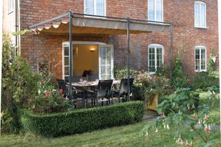 gazebo attached to the house to create a sheltered dining spot
