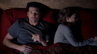 Derek puts on ear plugs while Meredith sleeps